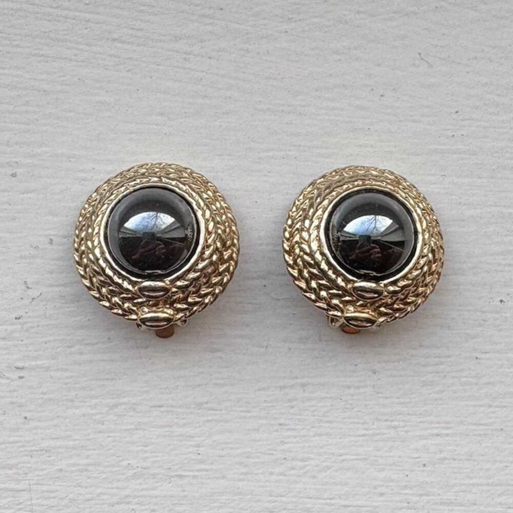Goldtone Metal with Pearlescent Black Center Clip-On Earrings
